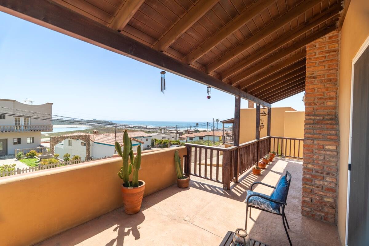 Covered terrace with pergola and ocean views