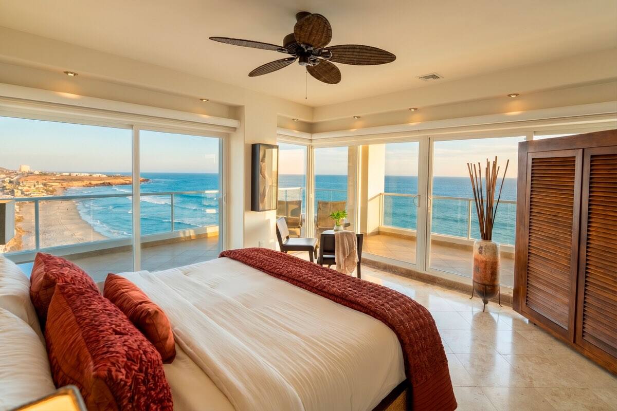 Primary suite with floor-to-ceiling ocean windows