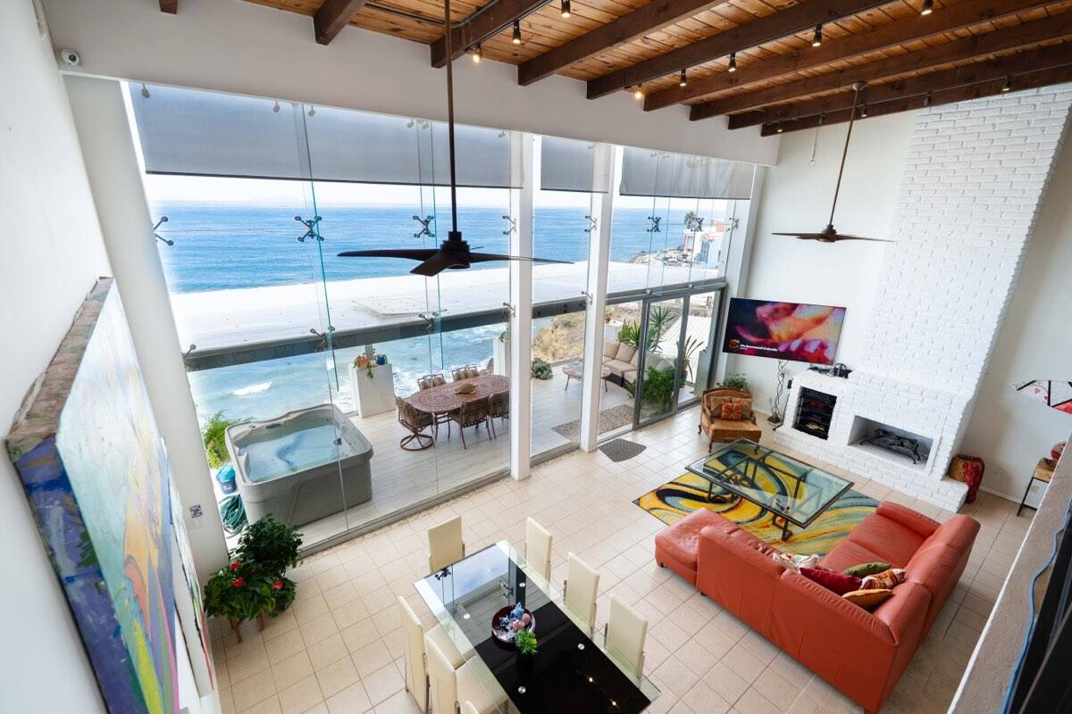 Living room with floor-to-ceiling ocean glass