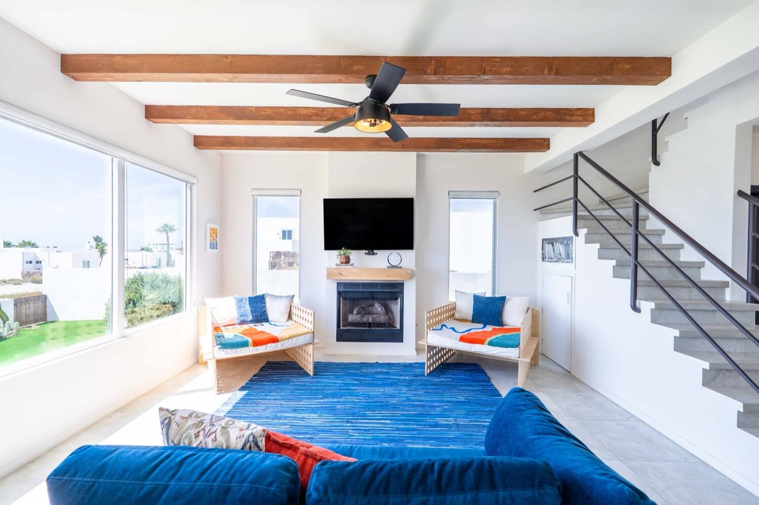 Living room with the gas fireplace and exposed wood beams